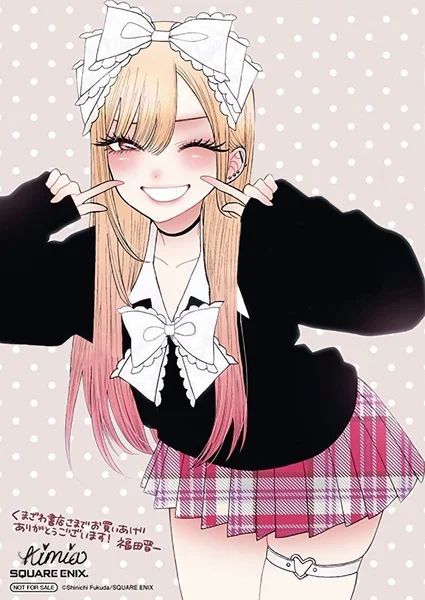 Marin Kitagawa winking and pinching her cheeks, in a big white bow and plaid skirt